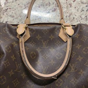 LV not authentic. Minor damage.